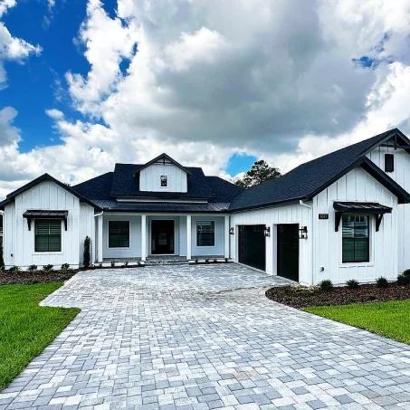 Image of a house under the name "The Lombardy" with an exterior view and floor plan. Includes details of square footage, room types, and contact information for Brian Designs and Habri Builders.